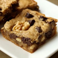 Golden-brown Blondies fresh from the oven, with gooey chocolate chips and a buttery aroma.