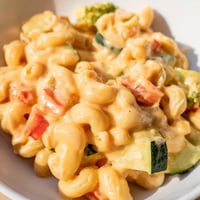 Golden roasted bell peppers and broccoli nestle into creamy cheddar-coated macaroni for a hearty Roasted Veggie Mac & Cheese.  