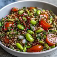 Vibrant Edamame and Quinoa Salad with crunchy vegetables and bright citrus dressing.